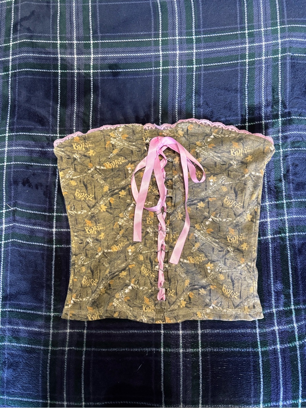 Bratz camo tube top w/pink ribbon,lace trim, and corset ribbon detailing.Size S.